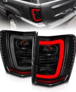 ANZO 1999-2004 Jeep Grand Cherokee LED Tail Lights w/ Light Bar Black Housing Smoke Lens