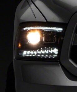 Raxiom 09-18 RAM 1500 LED Projector Headlights w/ Switchback Turn Signals- Blk Housing (Clear Lens)